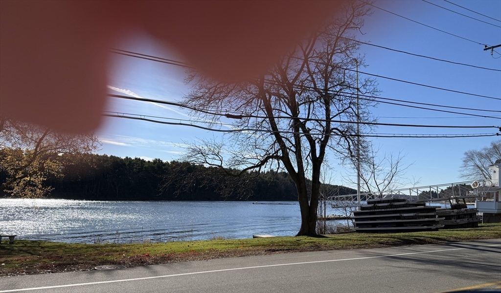 3 Laurel Place Amesbury, MA 01913 - Photo 6 of 14 a view of a yard with wooden fence