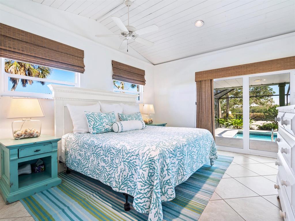 18 North Casey Key Road Osprey, FL 34229 - Photo 21 of 49 a bedroom with a bed and a large window