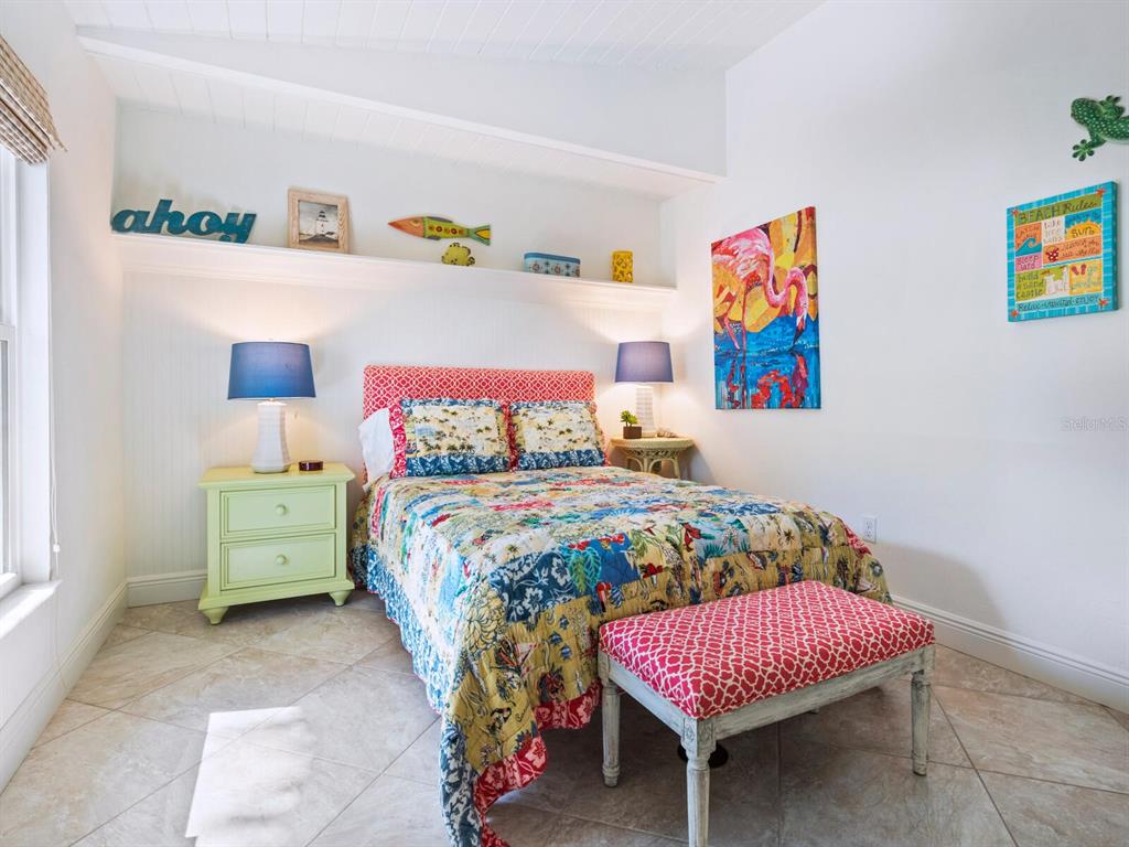 18 North Casey Key Road Osprey, FL 34229 - Photo 25 of 49 a bedroom with a bed and furniture