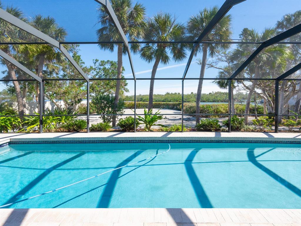 18 North Casey Key Road Osprey, FL 34229 - Photo 8 of 49 a view of swimming pool with a outdoor seating