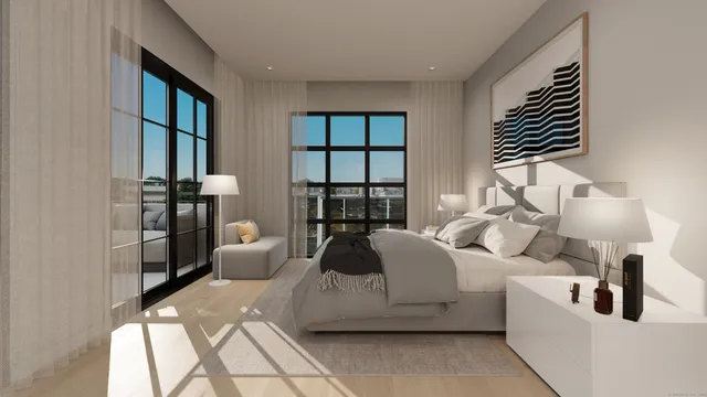 a bedroom with furniture and a large window