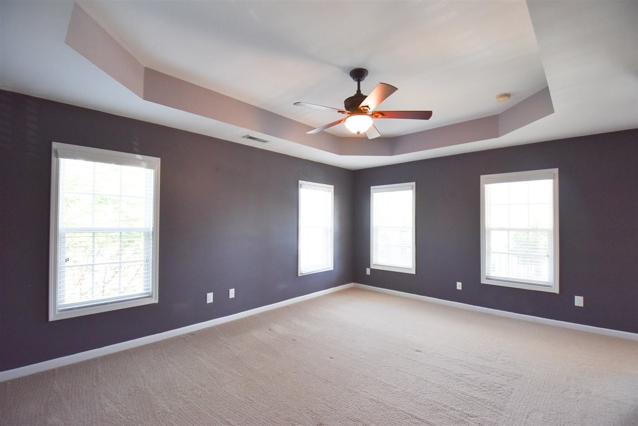 2712 Cloud Mist Circle Raleigh, NC 27614 - Photo 14 of 30 2nd Floor has neutral carpet throughout: the Master Suite offers a tray ceiling, CF, lots of windows, his and hers WICs, access to a private covered Balcony & large private Bath. Master Bedroom