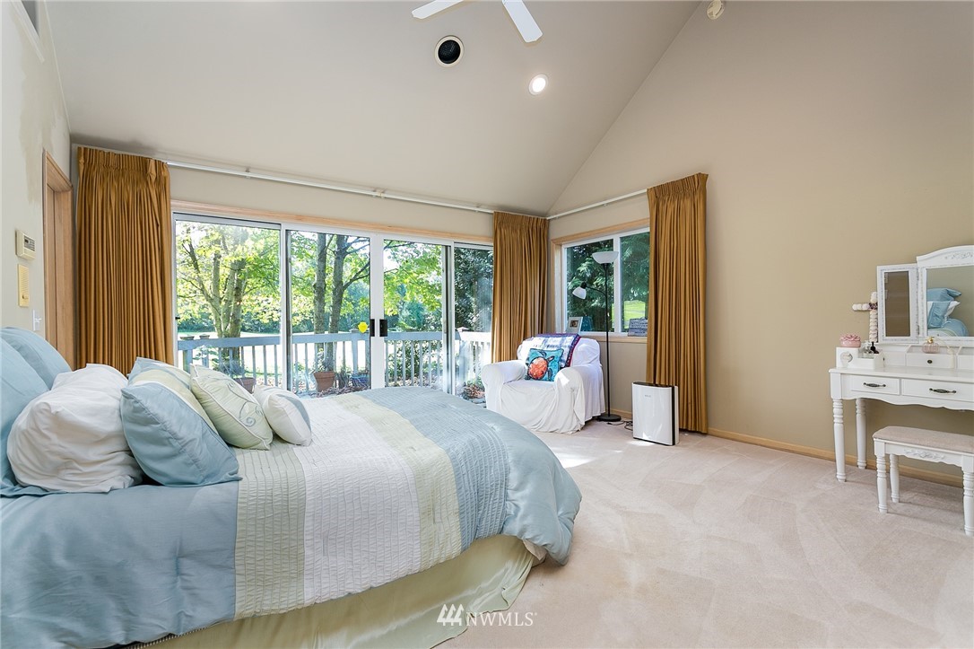 5520 Canvasback Road Blaine, WA 98230 - Photo 14 of 31 a bedroom with a bed and a large window