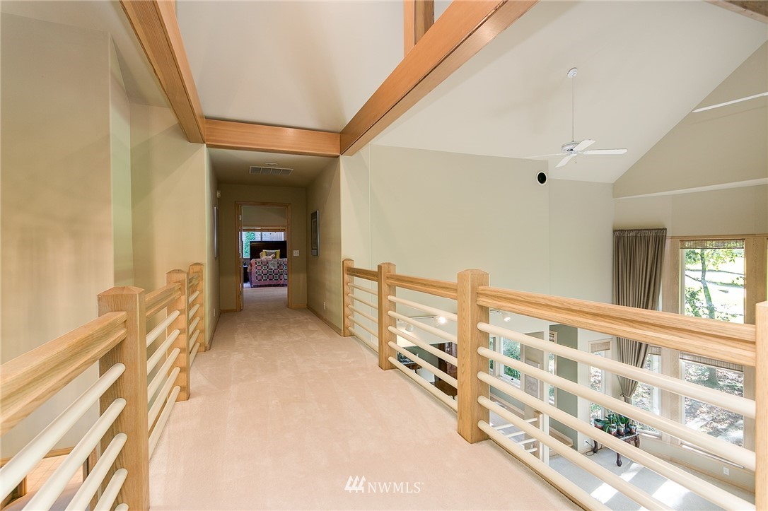 5520 Canvasback Road Blaine, WA 98230 - Photo 21 of 31 a view of a bedroom with wooden floor and windows
