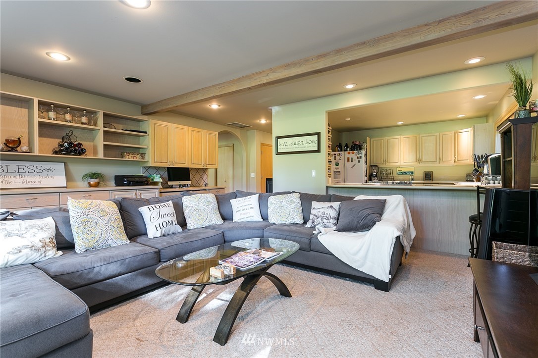 5520 Canvasback Road Blaine, WA 98230 - Photo 25 of 31 a living room with furniture and kitchen view