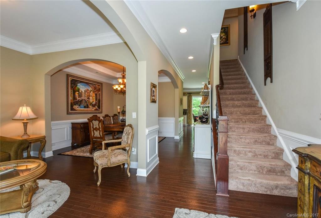 6004 Fallondale Road, Unit 881 Waxhaw, NC 28173 - Photo 4 of 20 a living room with furniture and a wooden floor