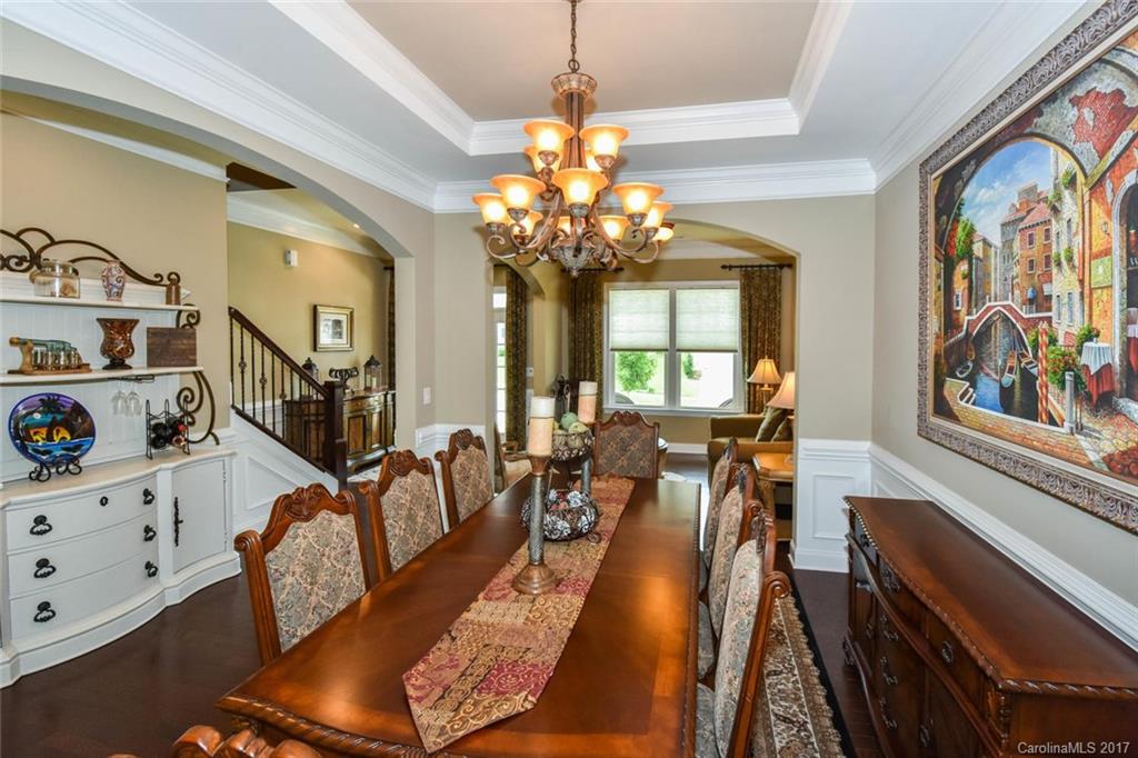 6004 Fallondale Road, Unit 881 Waxhaw, NC 28173 - Photo 7 of 20 a living room with furniture chandelier and a large window