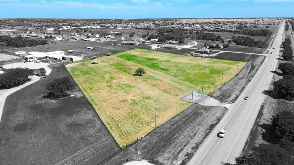a view of a swimming pool with a yard