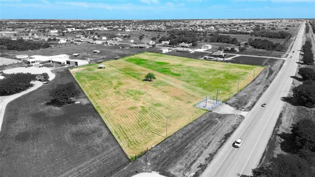 a view of a swimming pool with a yard