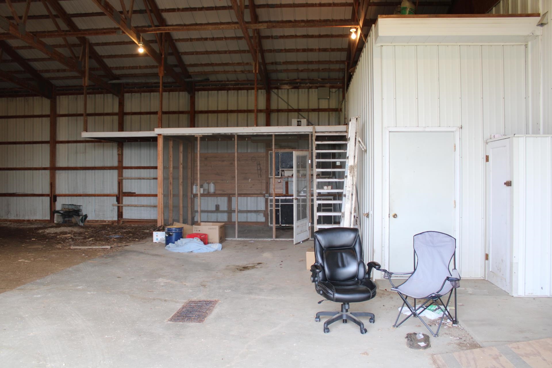 26131 Straw School Road Shannon, IL 61078 - Photo 8 of 34 a view of a workspace with furniture and a window
