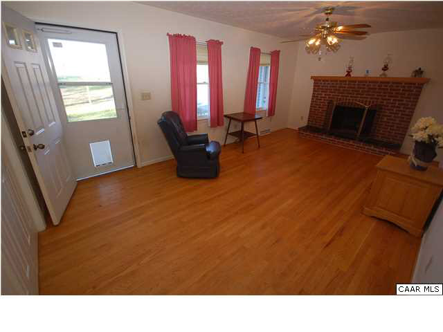 3624 Welsh Run Road Ruckersville, VA 22968 - Photo 15 of 31 a living room with furniture and a fireplace