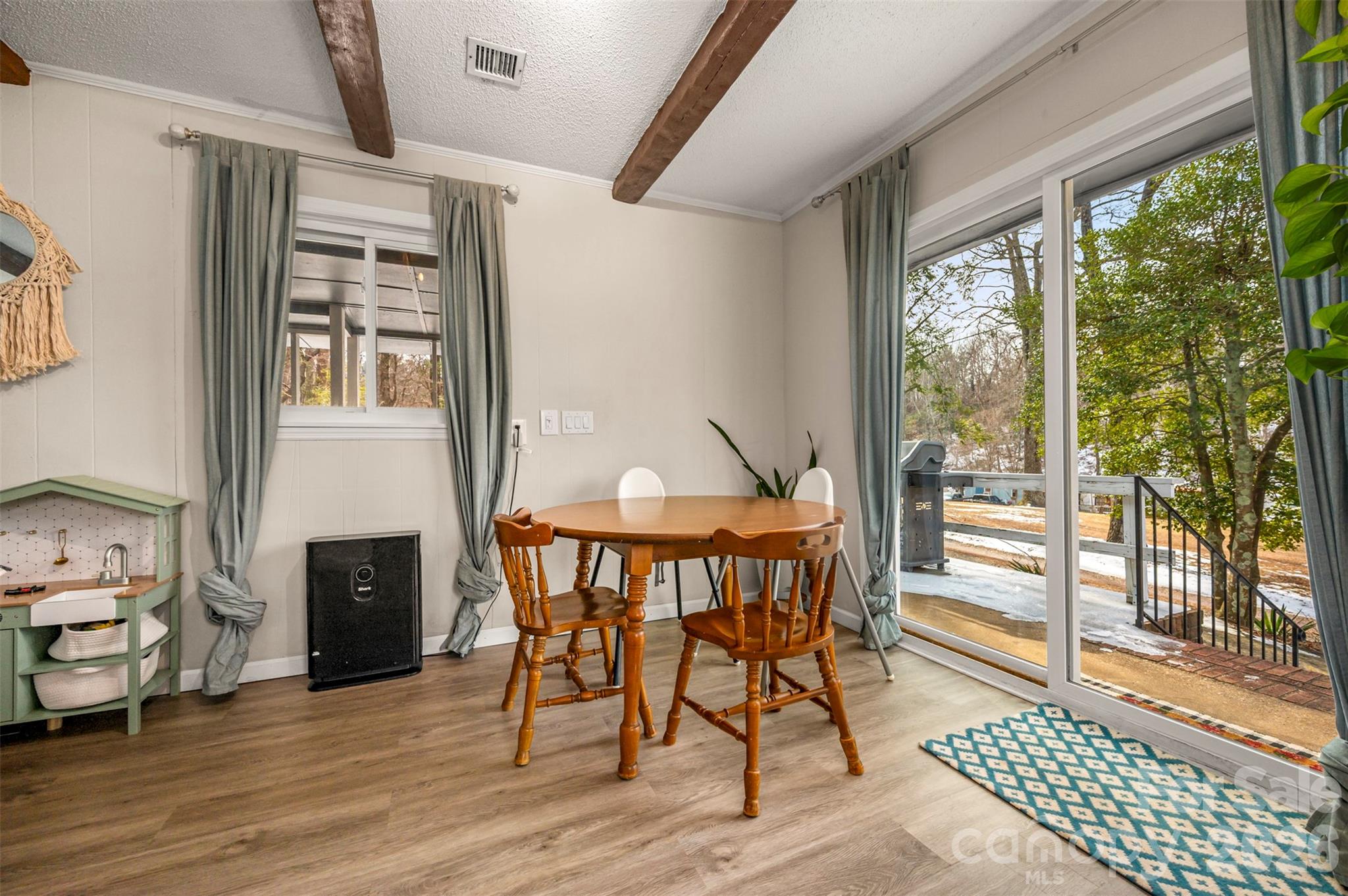 1685 Lynn Road Columbus, NC 28722 - Photo 12 of 31 a view of a dining room with furniture window and wooden floor
