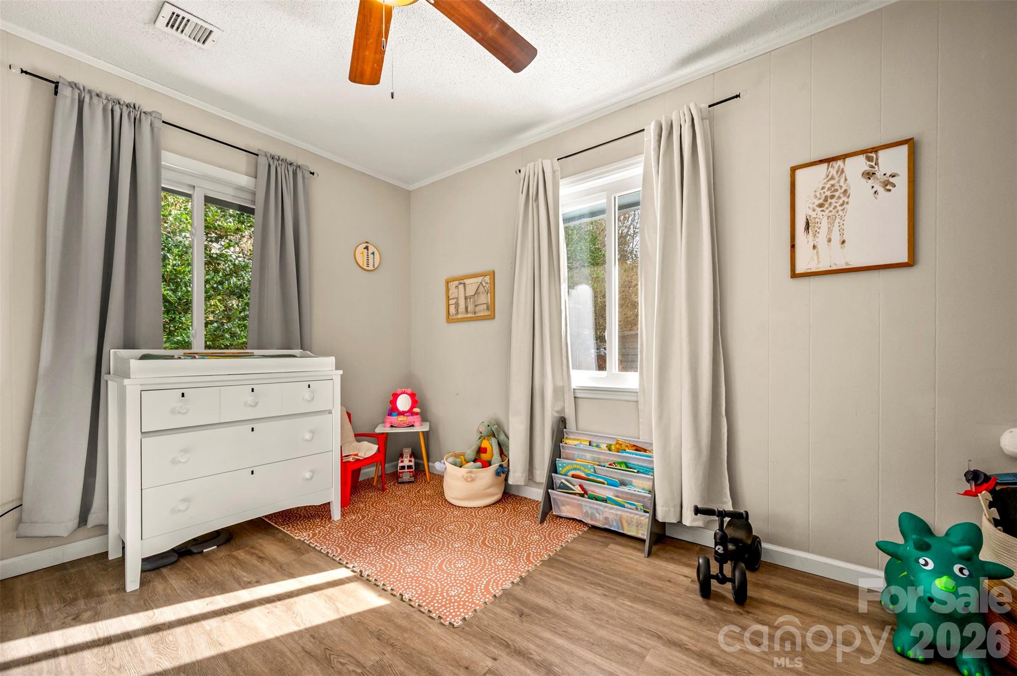 1685 Lynn Road Columbus, NC 28722 - Photo 15 of 31 a view of a bedroom with baby bed and a window