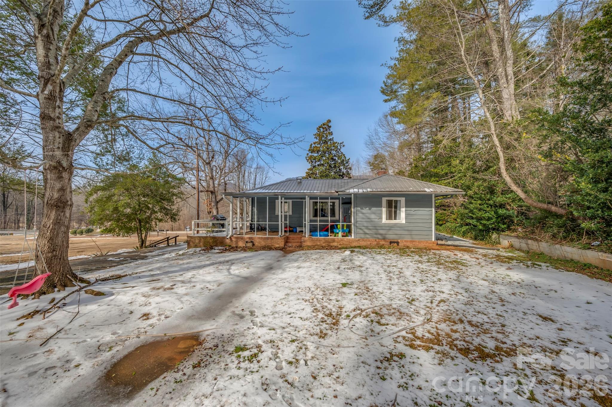 1685 Lynn Road Columbus, NC 28722 - Photo 20 of 31 a front view of a house with a yard