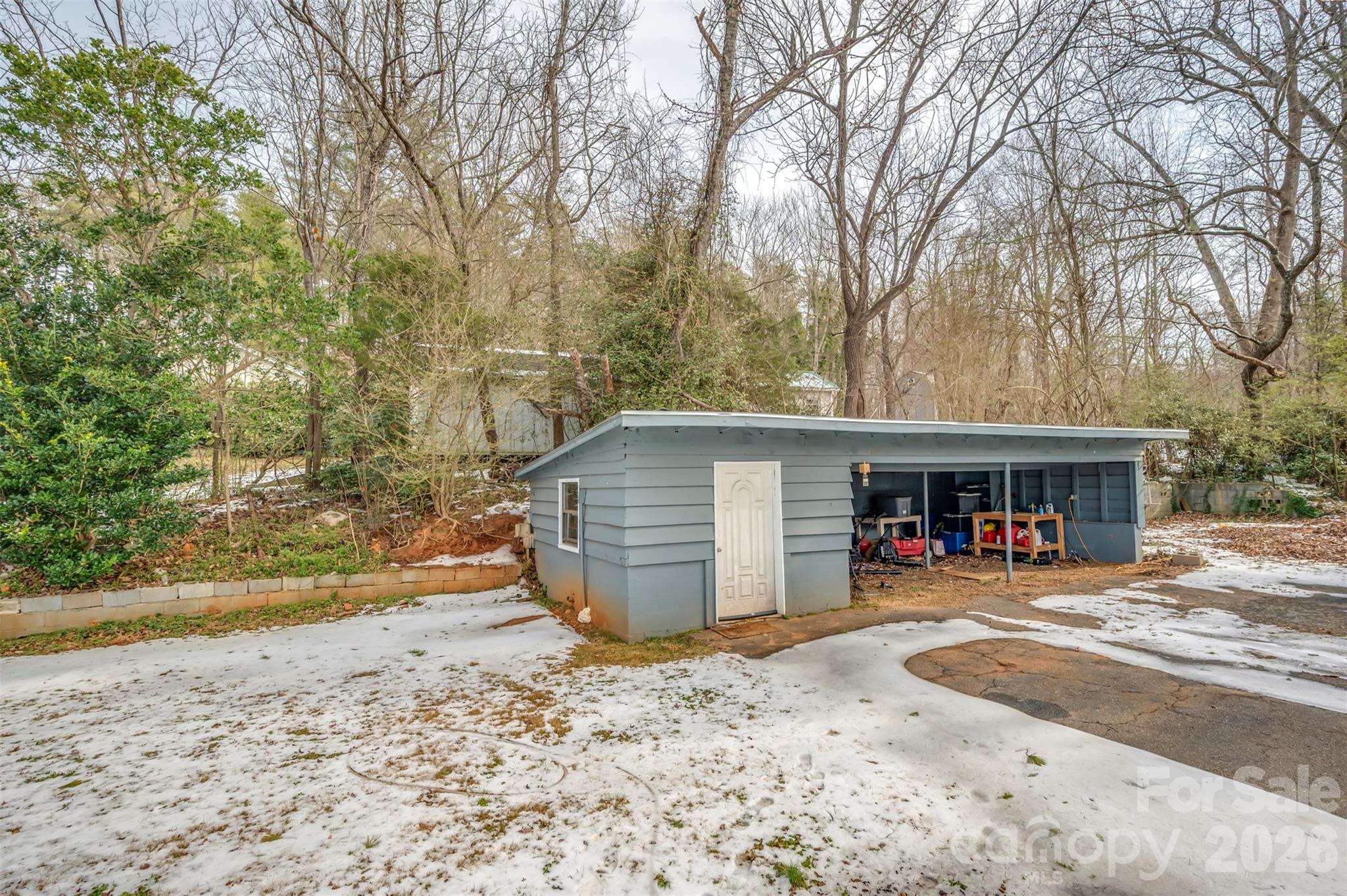 1685 Lynn Road Columbus, NC 28722 - Photo 25 of 31 front view of a house with a yard and garage