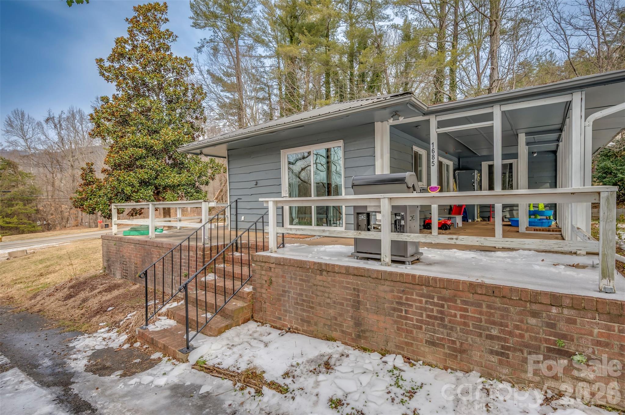 1685 Lynn Road Columbus, NC 28722 - Photo 31 of 31 a view of a house with a patio