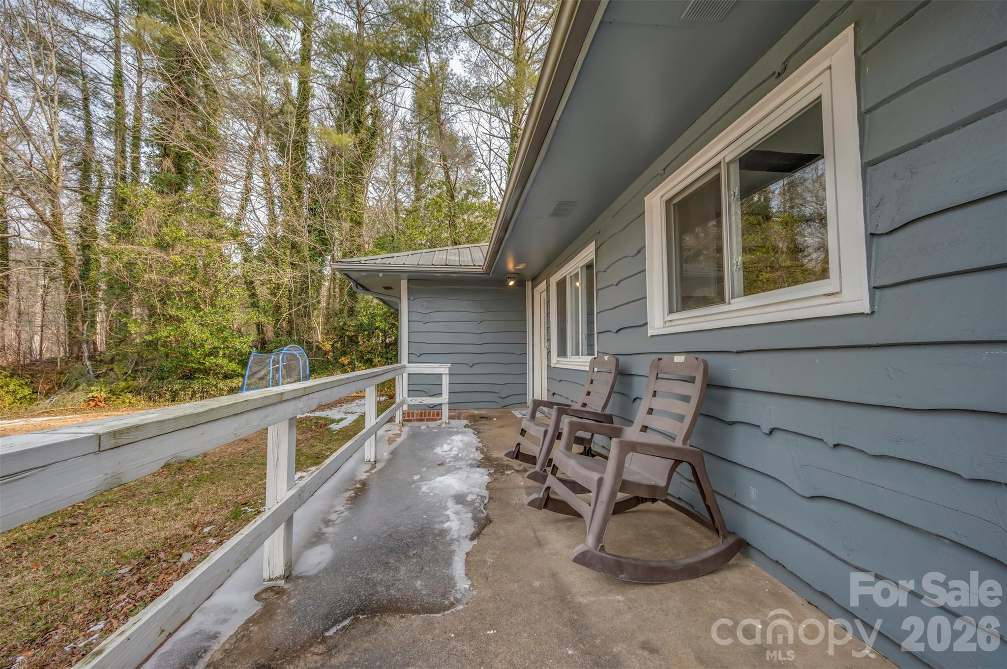 1685 Lynn Road Columbus, NC 28722 - Photo 4 of 31 a view of a chair and tables in the balcony