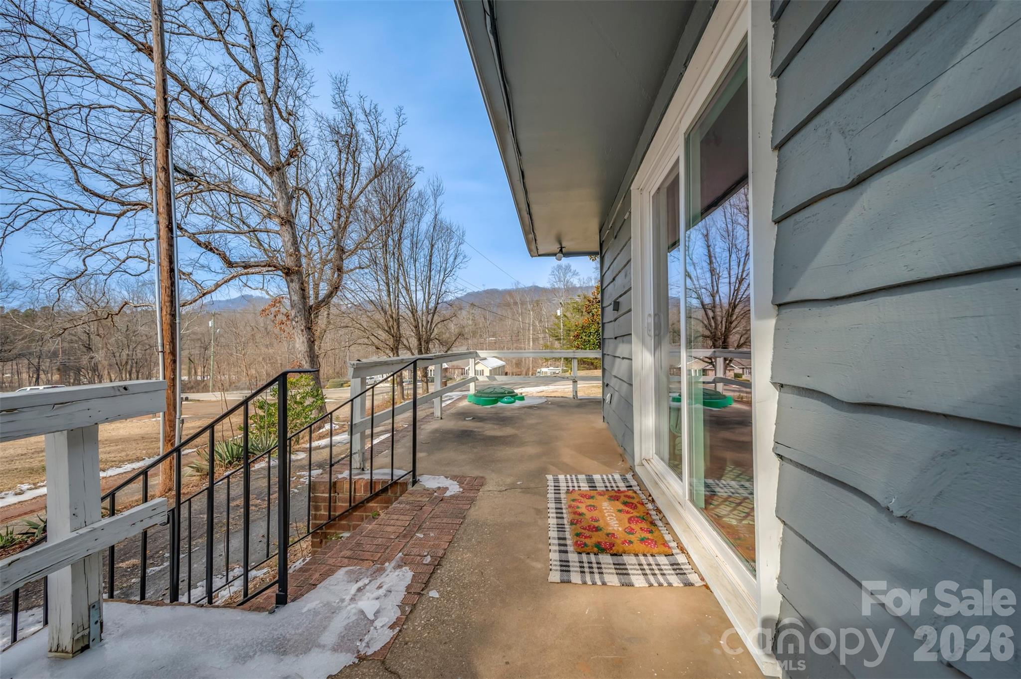 1685 Lynn Road Columbus, NC 28722 - Photo 6 of 31 a street view with wooden stairs