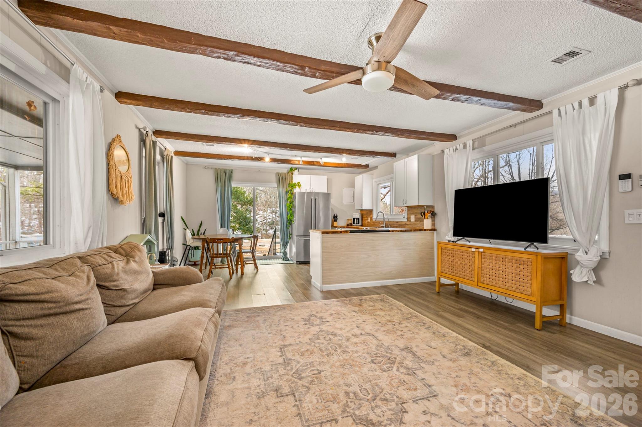 1685 Lynn Road Columbus, NC 28722 - Photo 7 of 31 a living room with furniture and a flat screen tv