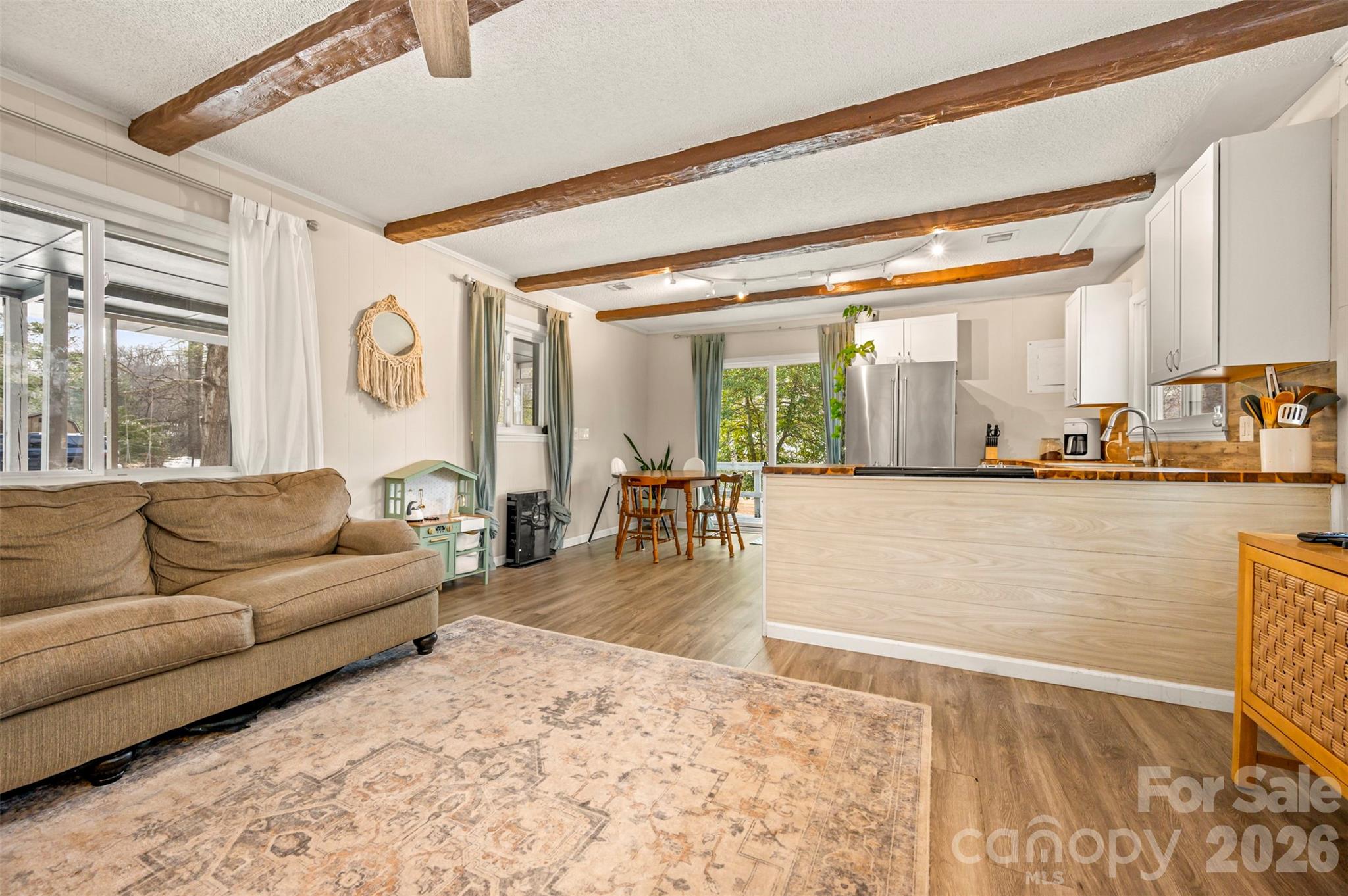 1685 Lynn Road Columbus, NC 28722 - Photo 8 of 31 a living room with furniture and a large window