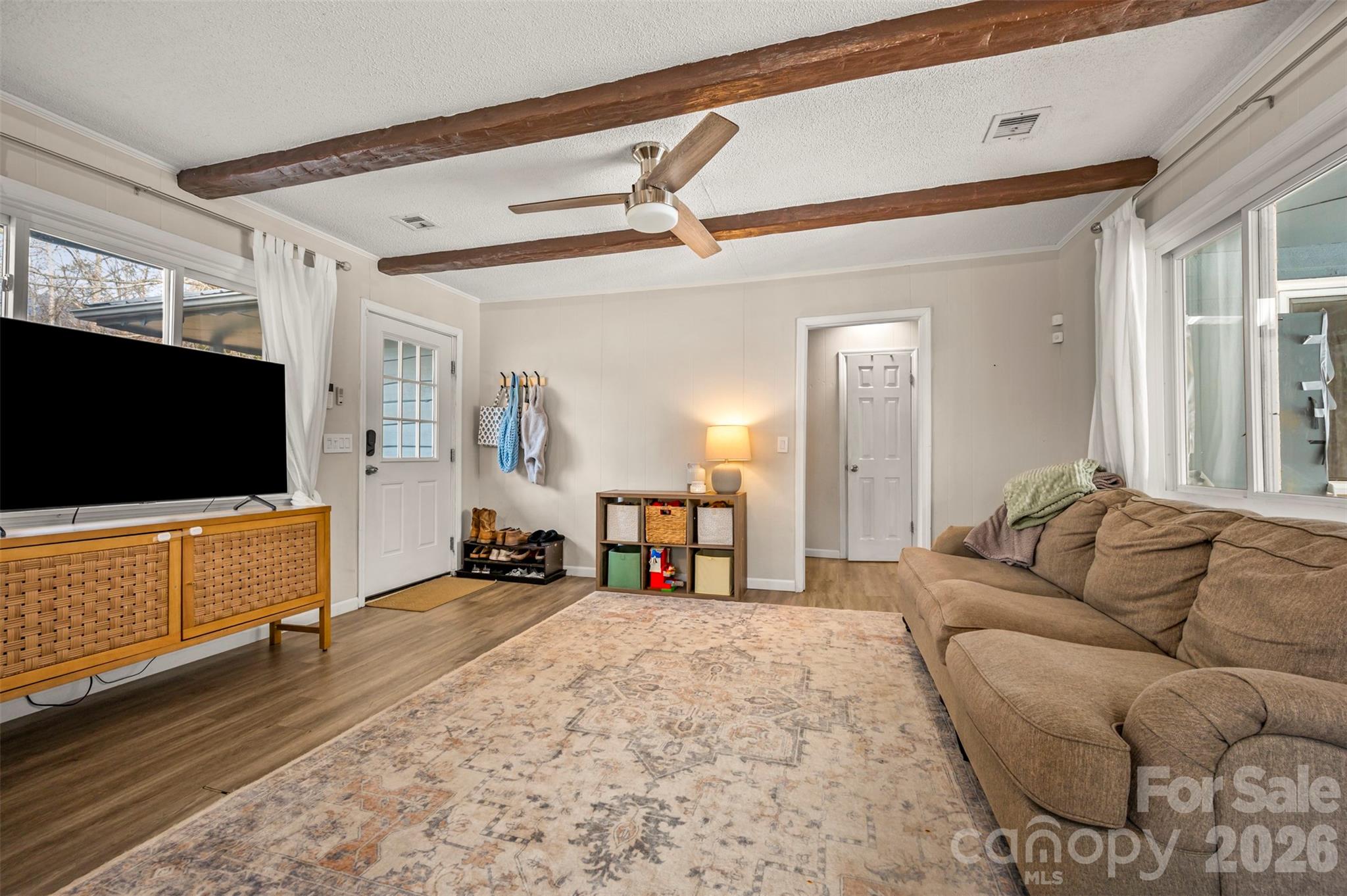1685 Lynn Road Columbus, NC 28722 - Photo 9 of 31 a living room with furniture and a flat screen tv