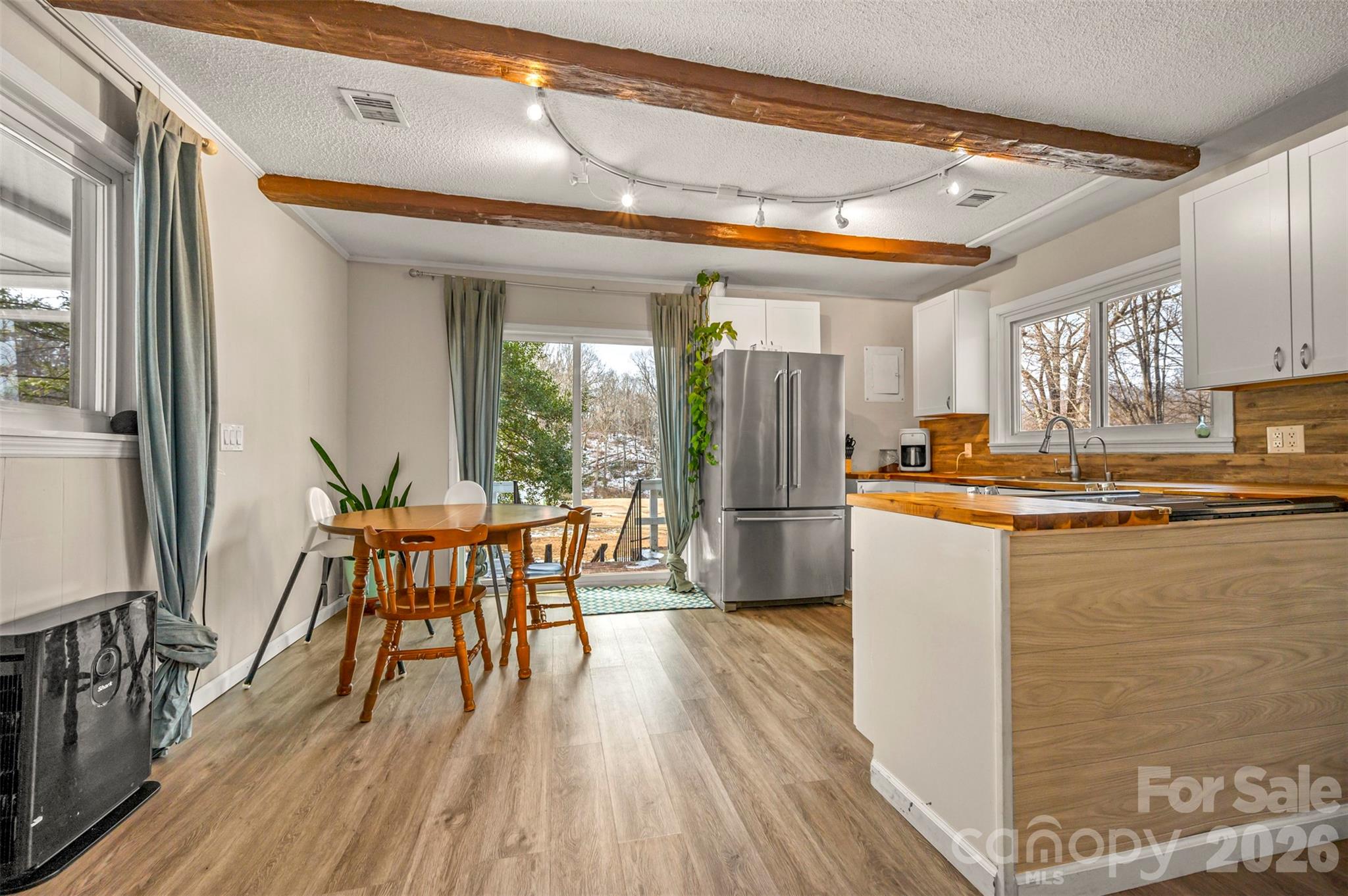 1685 Lynn Road Columbus, NC 28722 - Photo 10 of 31 a dining room with furniture and wooden floor