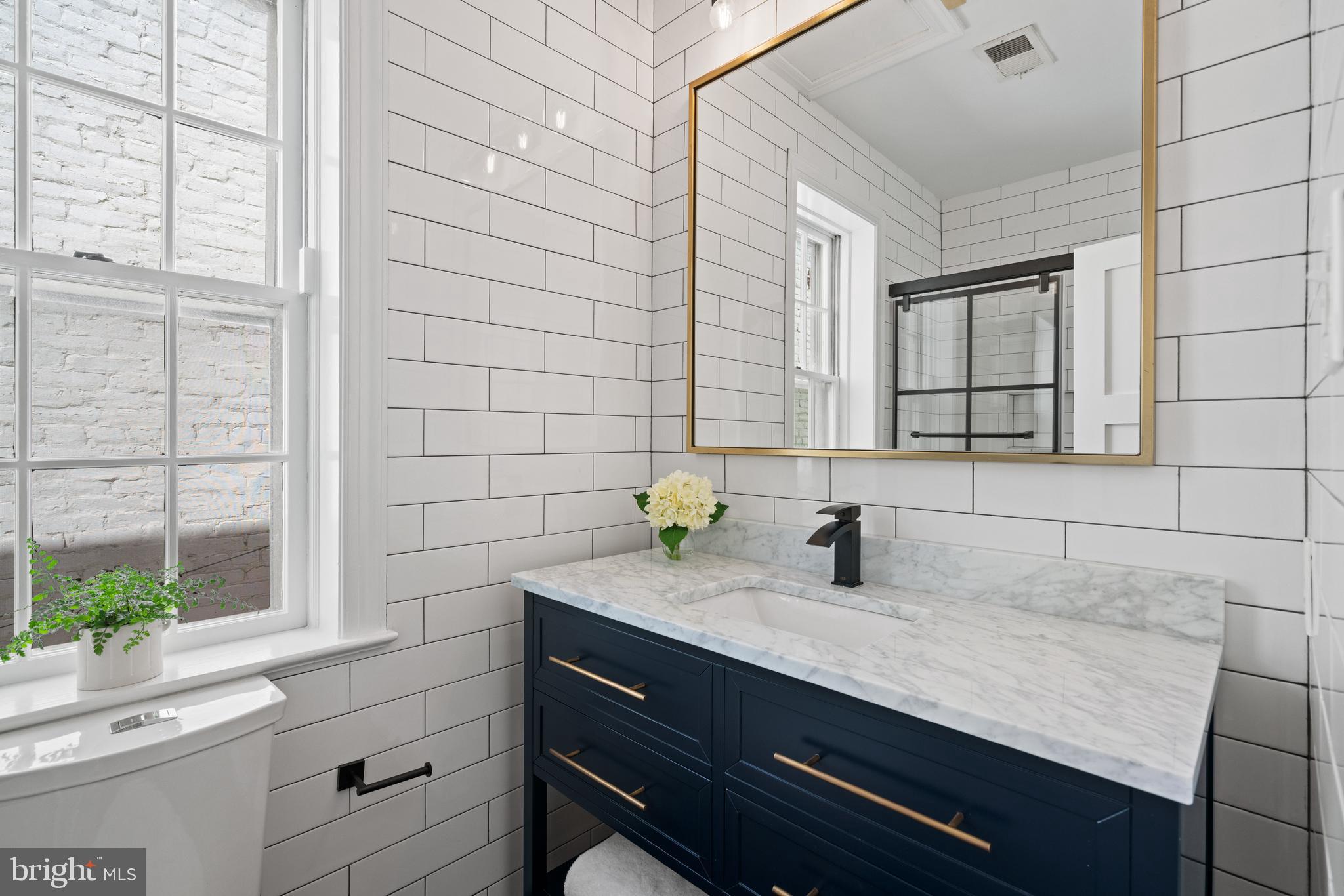 611 F Street Northeast Washington, DC 20002 - Photo 33 of 34 Updated Upper Level Guest Bathroom with Tub/Shower