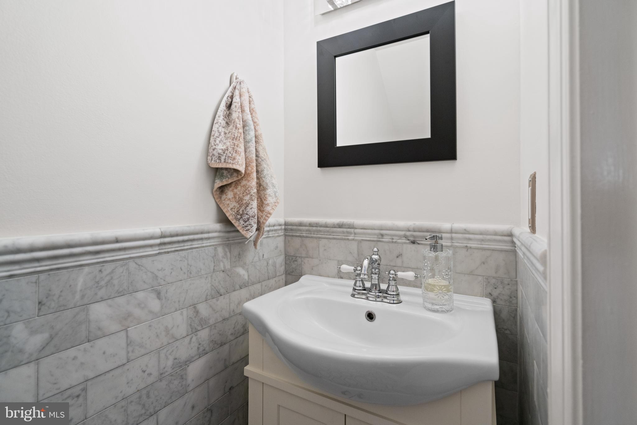 611 F Street Northeast Washington, DC 20002 - Photo 10 of 34 Main Level Powder Room Located Under the Stairs