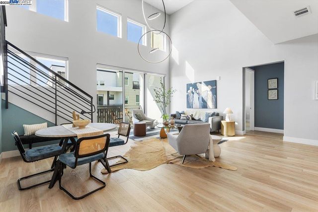 a room with lots of windows and white walls