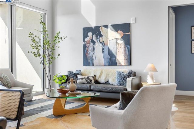 a living room with furniture or couch and a table