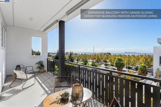 a bedroom with a bed and a table chair