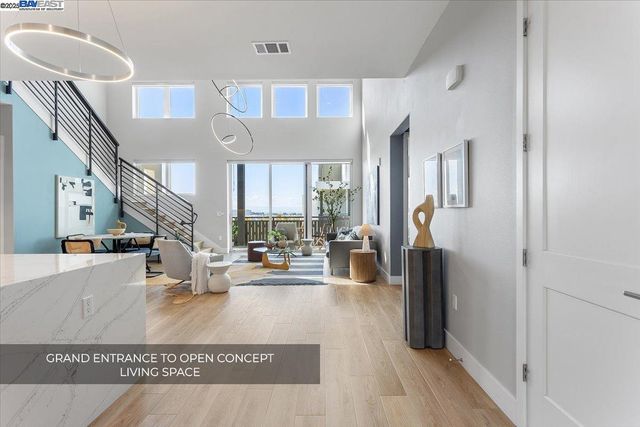 a view of living room with furniture and a large window