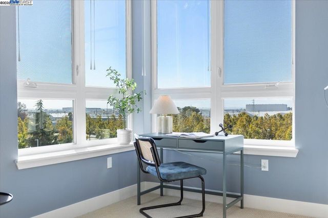 a view of a livingroom with furniture and staircase