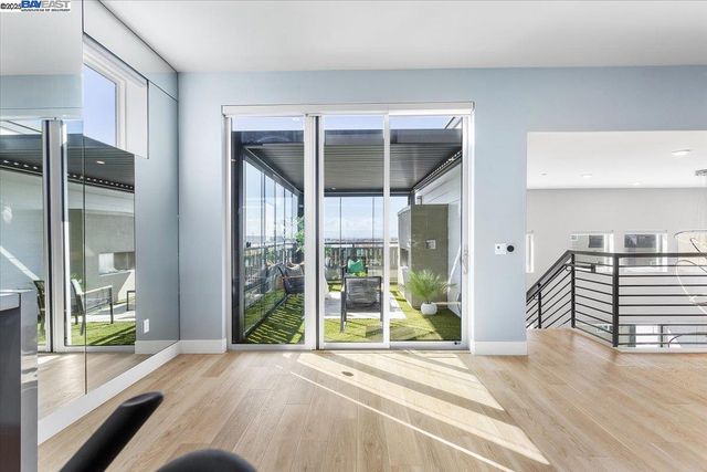 a bedroom with bed and a potted plant