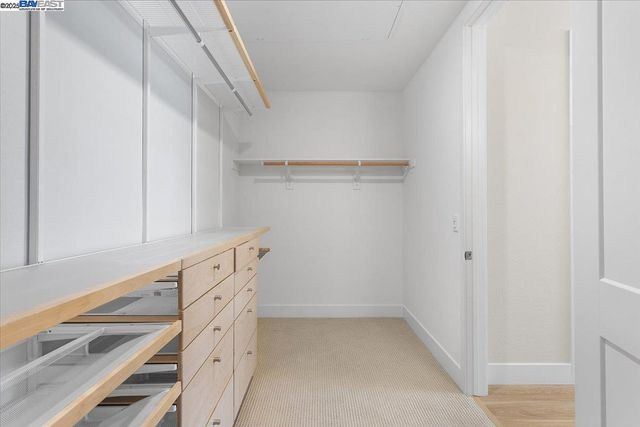 a living room with patio furniture and a wooden floor