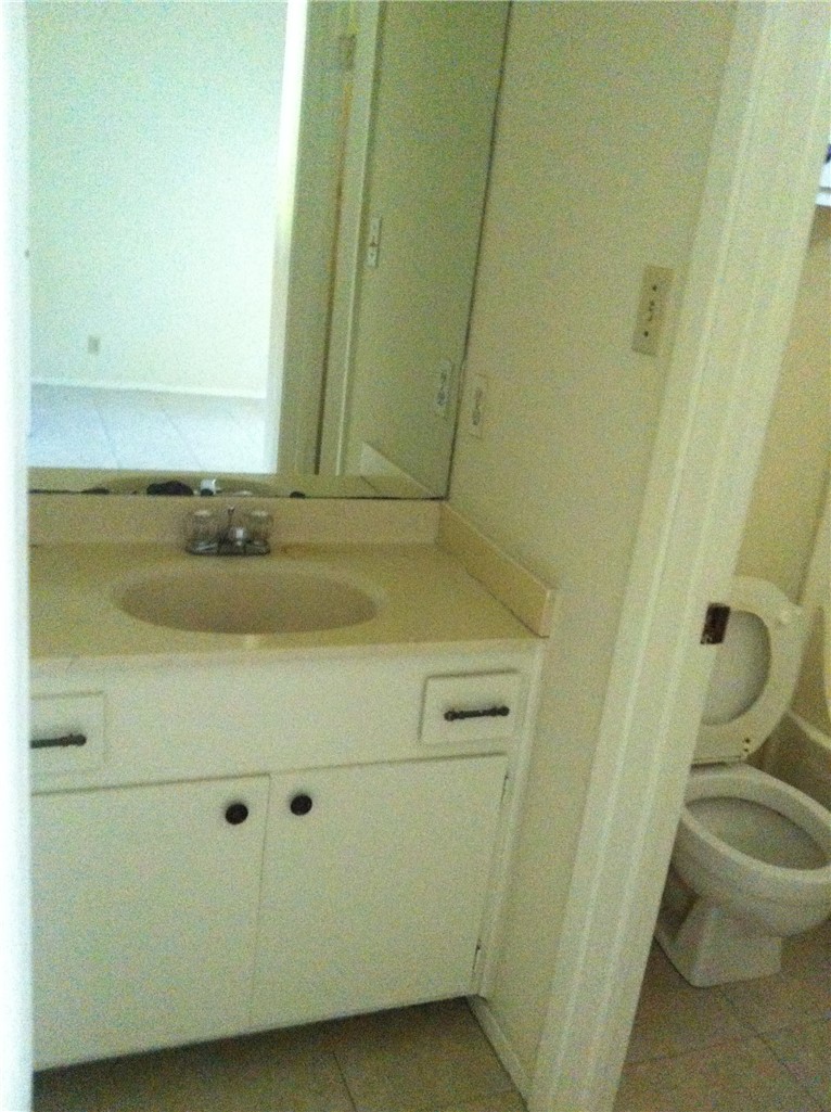 619 West 37th Street, Unit 101 Austin, TX 78705 - Photo 6 of 14 a bathroom with a sink and a toilet