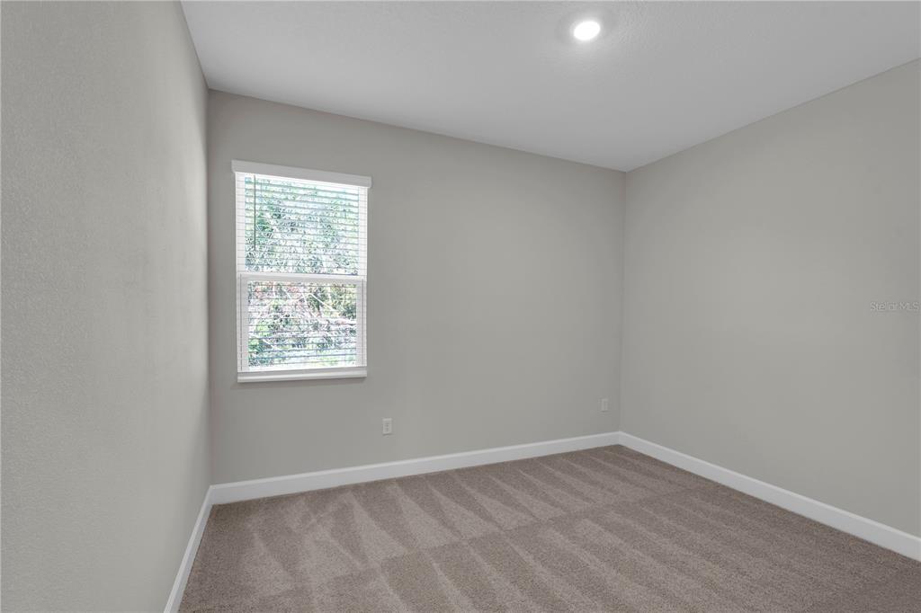 4451 Southwest 160 Loop Ocala, FL 34473 - Photo 11 of 15 an empty room with a window