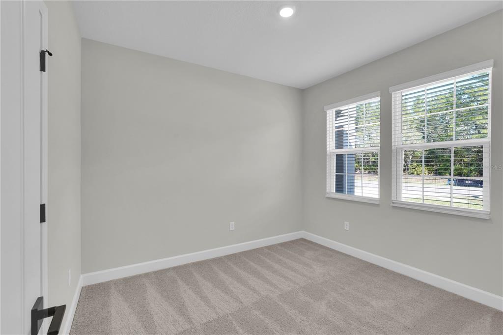 4451 Southwest 160 Loop Ocala, FL 34473 - Photo 13 of 15 an empty room with a window