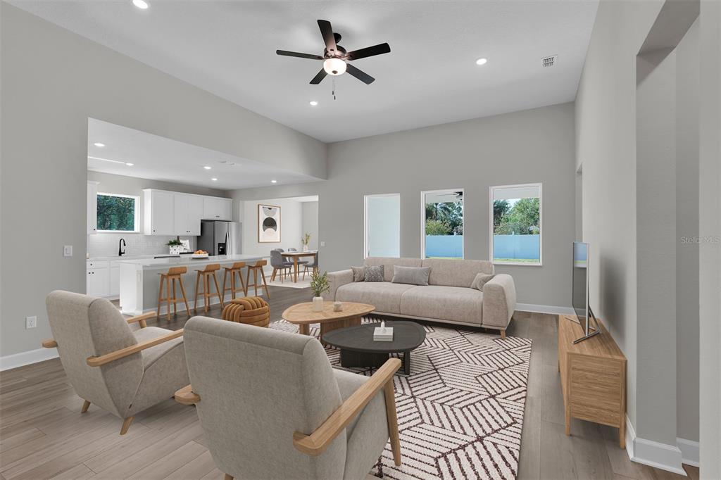 4451 Southwest 160 Loop Ocala, FL 34473 - Photo 5 of 15 a living room with furniture and a large window