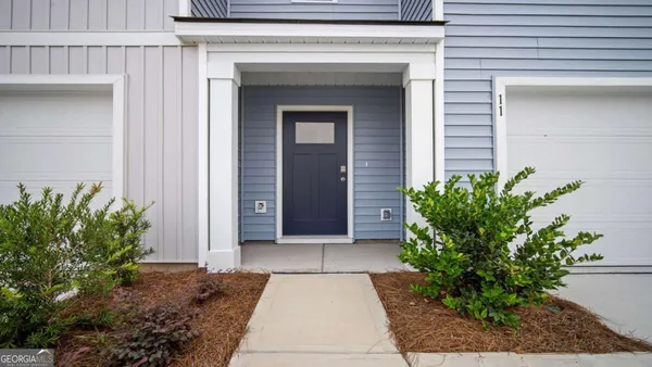 a entryway with a potted plant in front of door