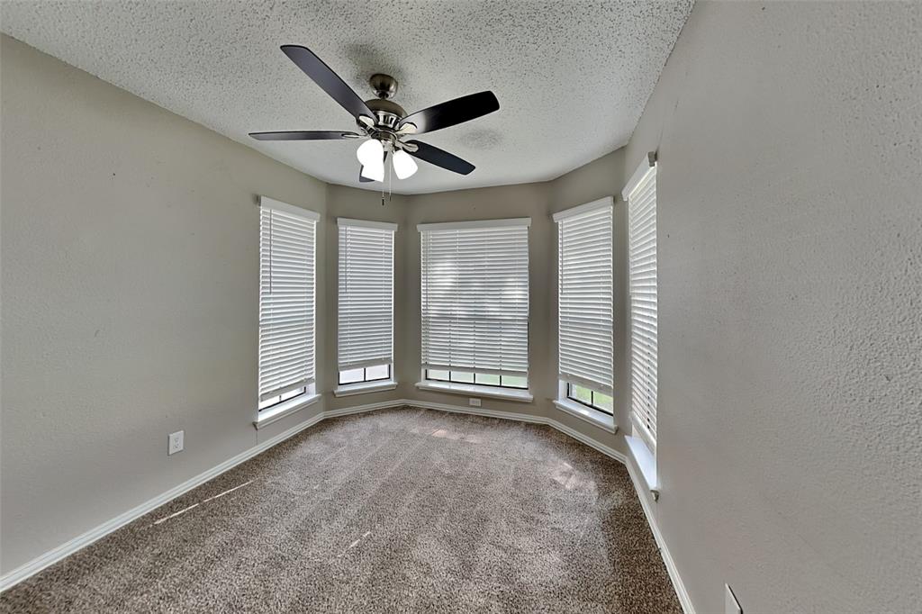 4649 Birchbend Lane Fort Worth, TX 76137 - Photo 14 of 18 a view of an empty room with a window