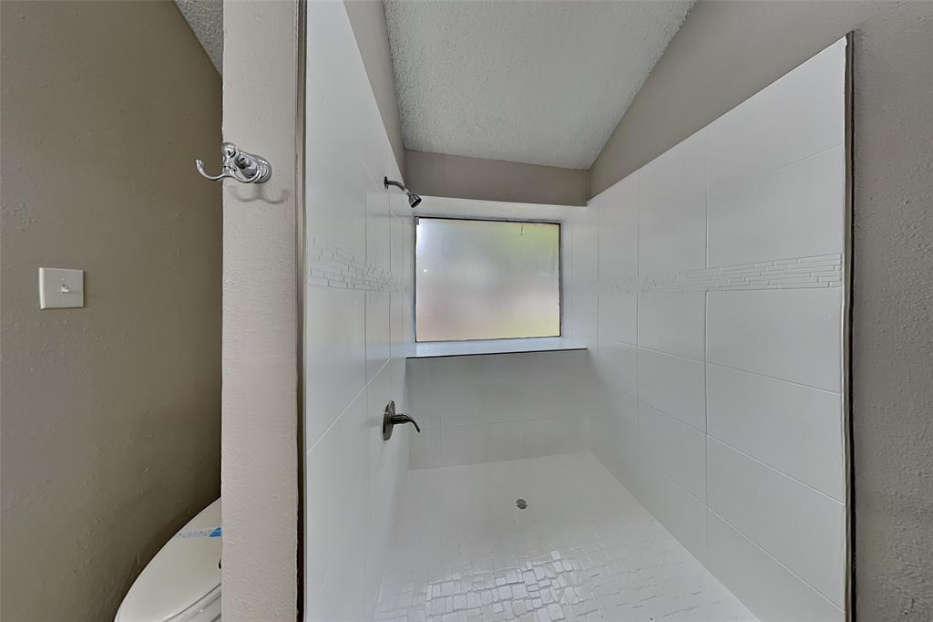 4649 Birchbend Lane Fort Worth, TX 76137 - Photo 9 of 18 a bathroom with a bathtub