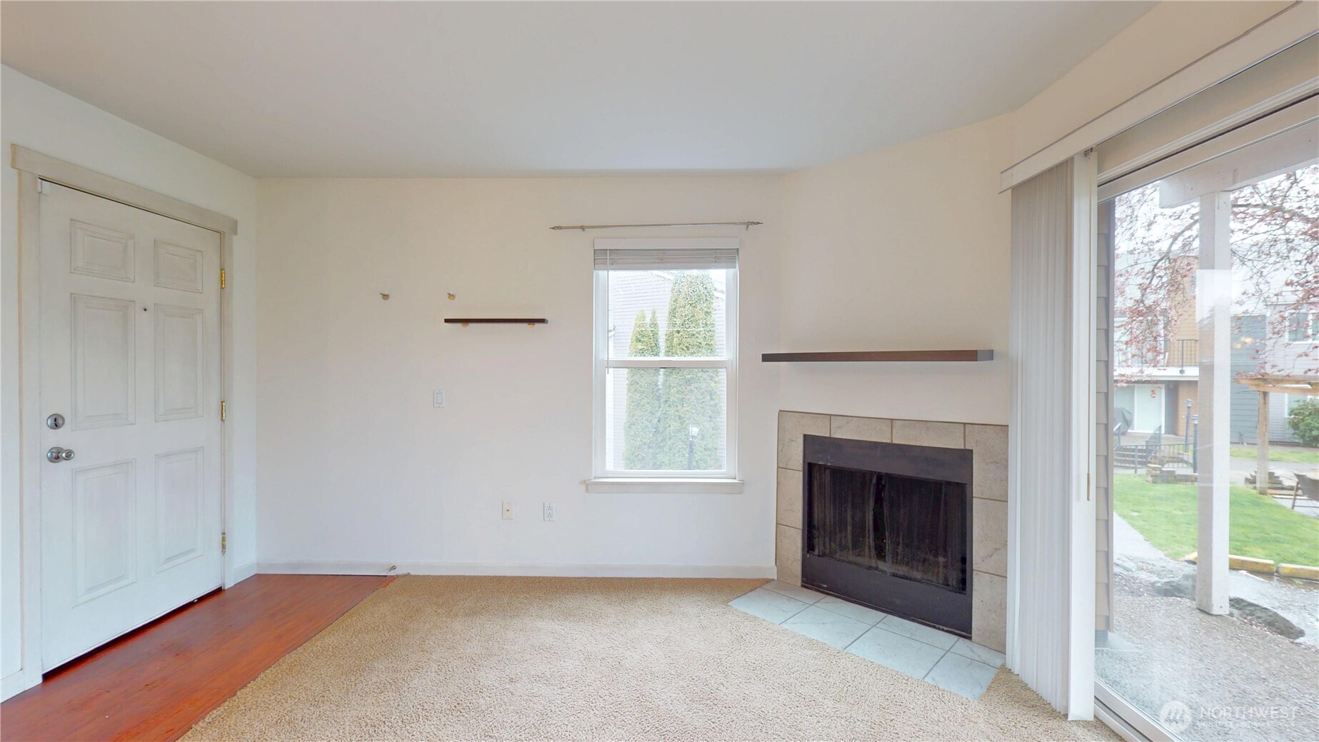 2613 South 272nd Street, Unit 21 Kent, WA 98032 - Photo 1 of 19 wooden floor fireplace and natural light in room