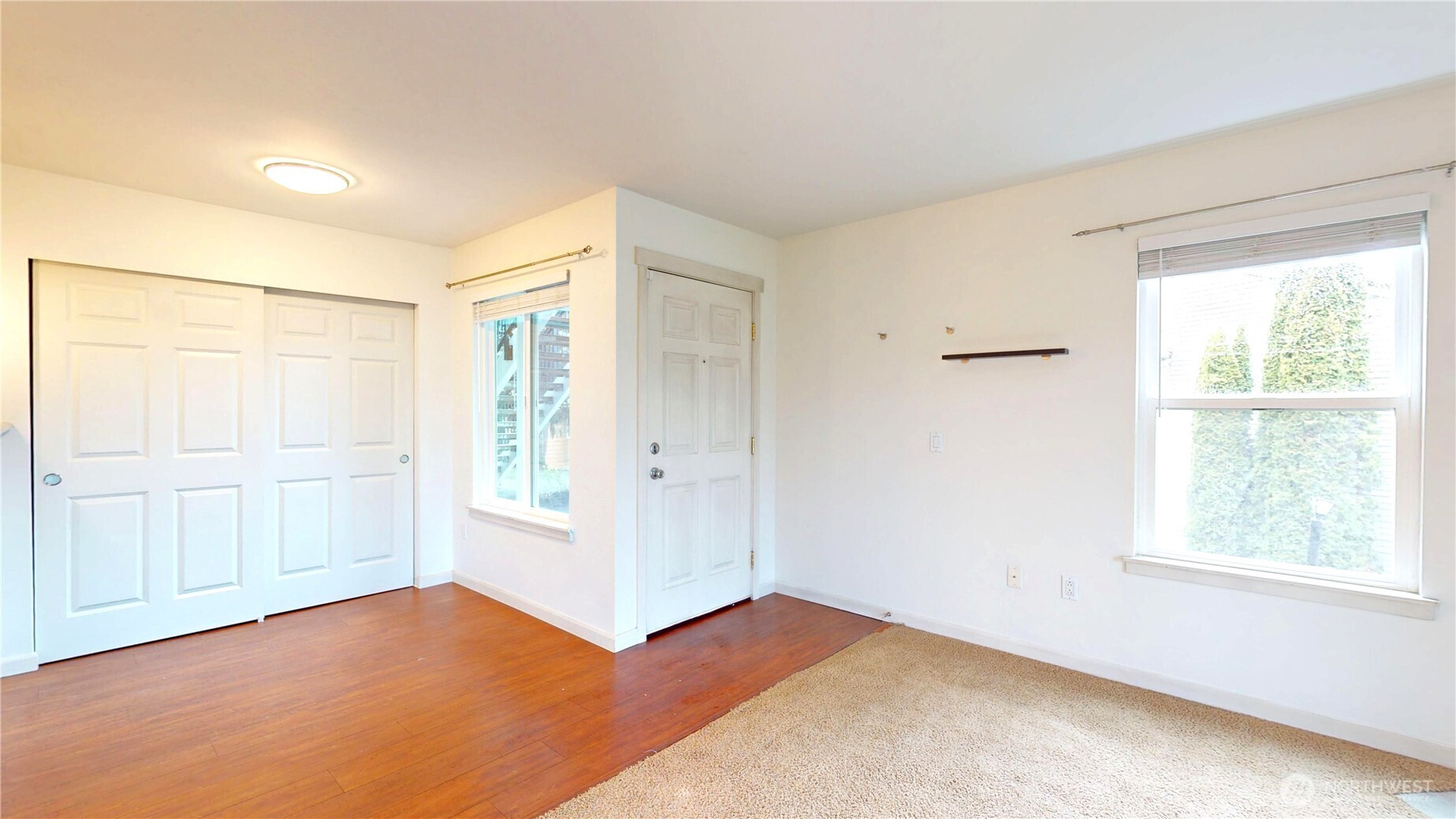 2613 South 272nd Street, Unit 21 Kent, WA 98032 - Photo 4 of 19 a view of an empty room with a window