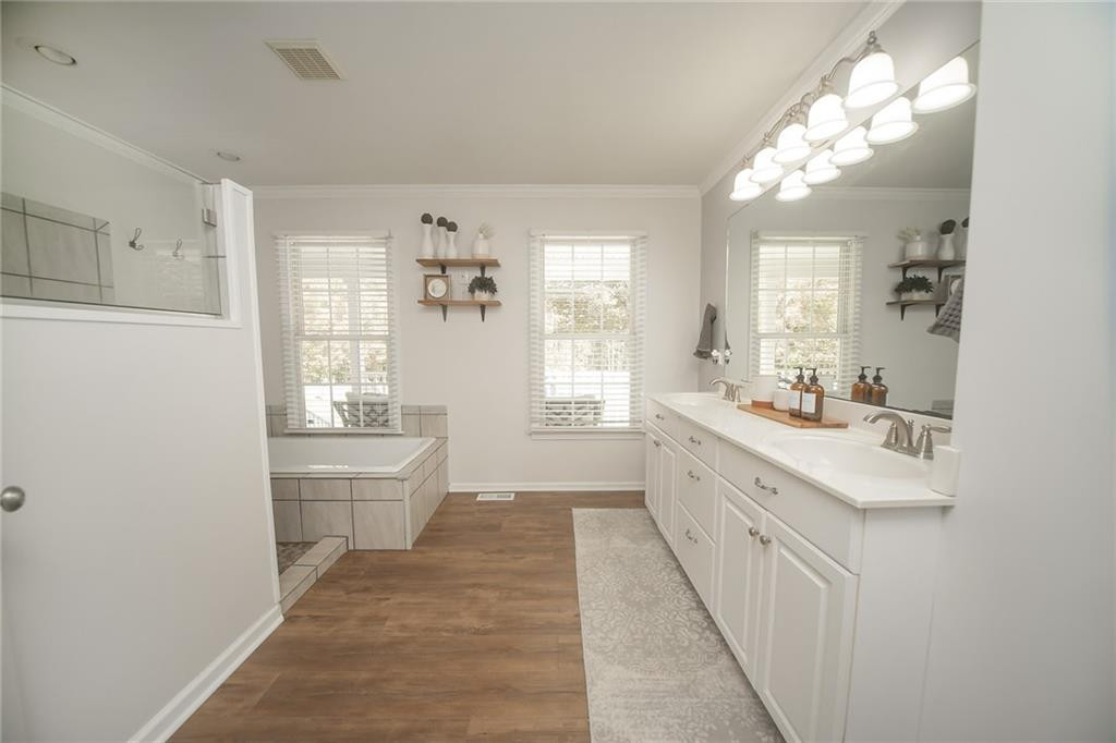 2741 Creek Point Road Graham, NC 27253 - Photo 16 of 36 a large white room with a large window and chandelier