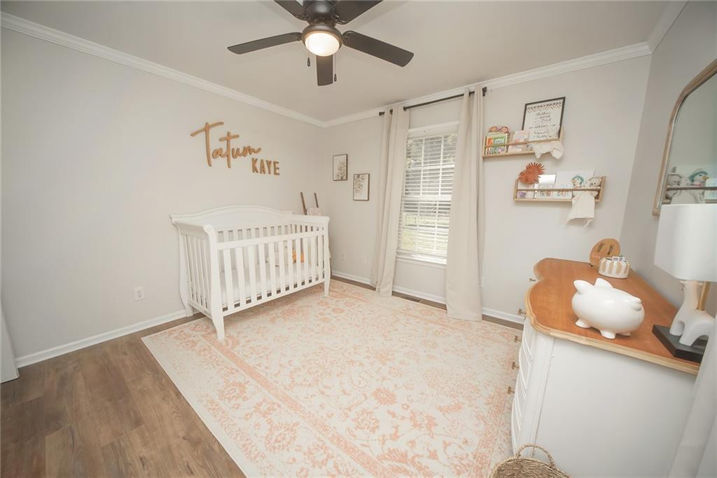 2741 Creek Point Road Graham, NC 27253 - Photo 21 of 36 a bedroom with furniture and a chandelier