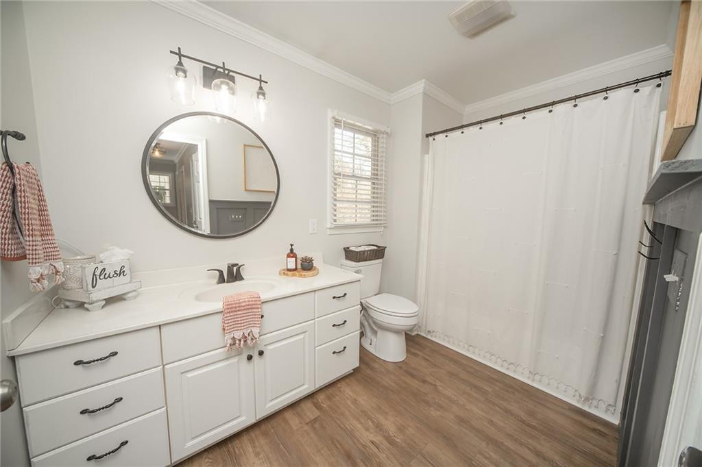 2741 Creek Point Road Graham, NC 27253 - Photo 23 of 36 a bathroom with a toilet sink double vanity and mirror