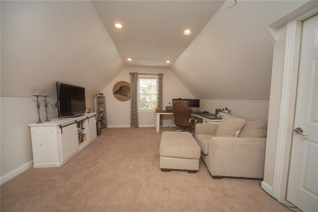 2741 Creek Point Road Graham, NC 27253 - Photo 26 of 36 a living room with furniture and a flat screen tv