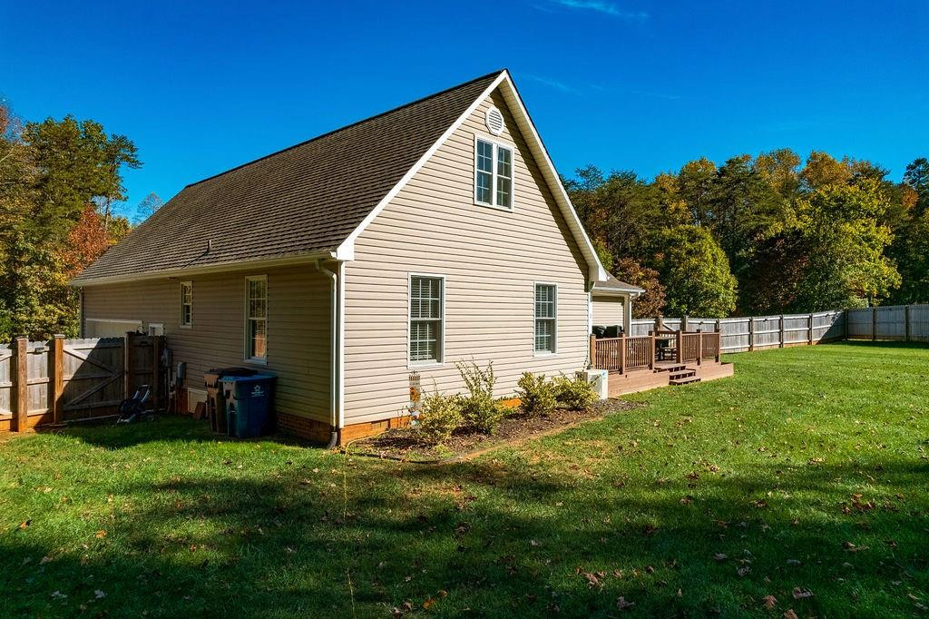 2741 Creek Point Road Graham, NC 27253 - Photo 29 of 36 a view of backyard with a garden and plants