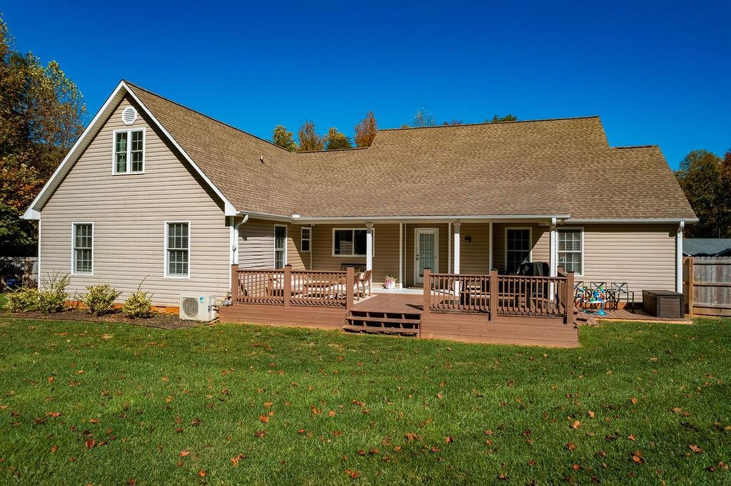 2741 Creek Point Road Graham, NC 27253 - Photo 30 of 36 a front view of house with yard and outdoor seating